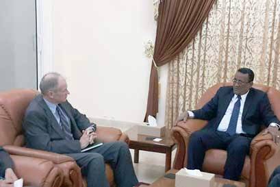 In this picture released by the Sudanese presidency, Sudanese presidential aide Ibrahim Mahmoud Hamid meets Ambassador Jerry Lanier in his office on 9 February 2016.