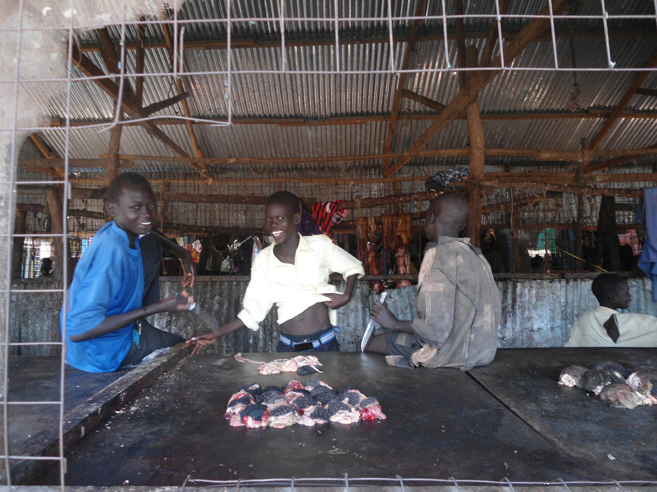 Young Boys selling meat at the butchers in Bor Marol Market, 27 April 2012 (ST)