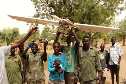In this picture released by the SPLM-N on 17 March, rebel fighters hold up drone aircraft they claimed to have shot down in South Kordofan area of Heiban on 15 March 2016