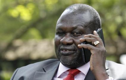 Machar speaks on a mobile phone after an interview with Reuters in Kenya's capital Nairobi July 8, 2015