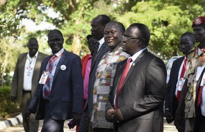 Riek Machar, center, walks to be sworn in at the presidential palace in the capital Juba, South Sudan Tuesday, April 26,  (Photo AP/Jason Patinkin)