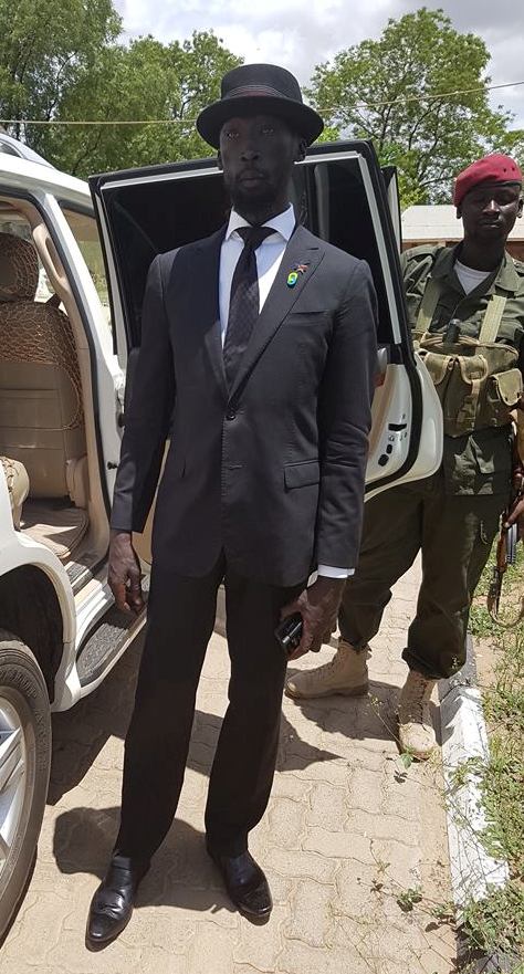 Minister Mabior Garang de Mabior arriving home after-being kicked out by Prsident Salva Kiir from the first sitting of the Council of Ministers for Being inappropriately dressed (Mabior's FaceBook page)