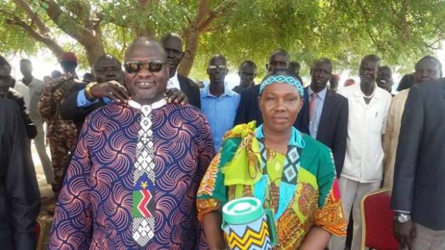 Anyuak community leaders giving necktie gift to FVP Riek Machar, and bead gift to his wife, Angelina Teny, at their Jebel Kujur residence, Sunday, 12 June, 2016 (ST photo)