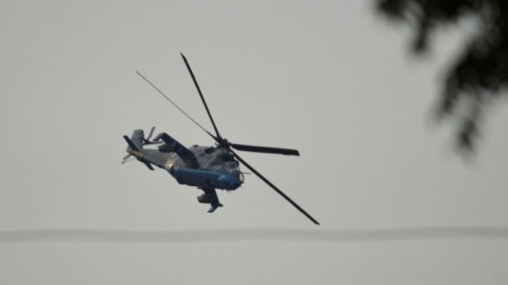A South Sudanese government helicopter patrols the streets following fighting in Juba, on 12 July (Reuters Photo)