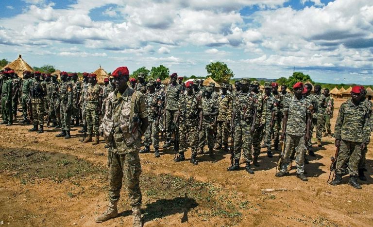 SPLA soldiers stand to attention at a containment site outside Juba on April 14, 2016 (AFP Photo)