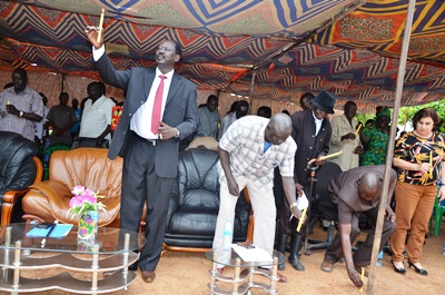 Jonglei state governor, Aguer Panyang joined by others to light candles in Bor on July 31, 2016 (ST)