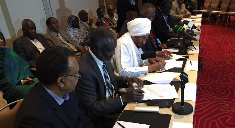 Sudan Call leaders sign the Roadmap Agreement paving the way for talks with the government on cessation of hostilities and humanitarian access on 8 August 2016 (ST Photo)
