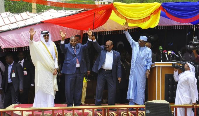 Bashir and his invitees wave hands at the the celebration marking the completion of the Doha Document for Peace in Darfur (DDPD)  in El-Fasher on 7 Sept 2016 (ST Photo)