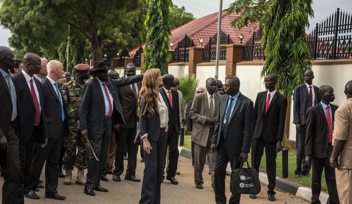 President Kiir points to bullet holes on a wall of the presidential palace in Juba after a meeting  with the visiting UN Security Council delegation on 4 September 2016 (UNMISS Photo)