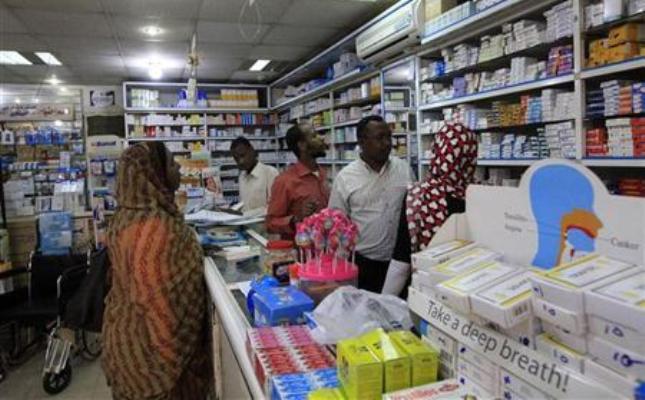 A customer buys medication at a pharmacy in Khartoum January 13, 2013. (Reuters/Mohamed Nureldin Abdallah Photo)