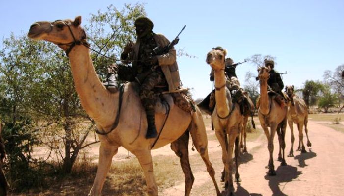 Gunmen riding camels in Darfur region (Photo Mia Farrow blog)