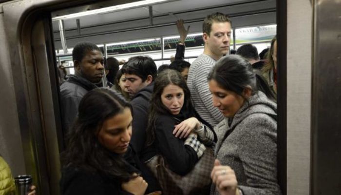 commuters_travel_trough_the_59th_street_subway_station_in_new_york_during_the_first_day_of_limited_subway._nov._1_2012_afpgetty_images.jpg