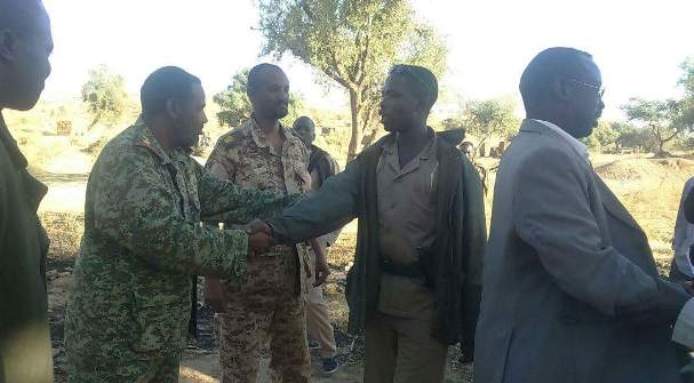 In this undated picture extended to ST on 21 January 2017, Tawila Commissioner (R) and splinter leader (2R) shake hands with their respective delegations in Jebel Marra during the negotiations