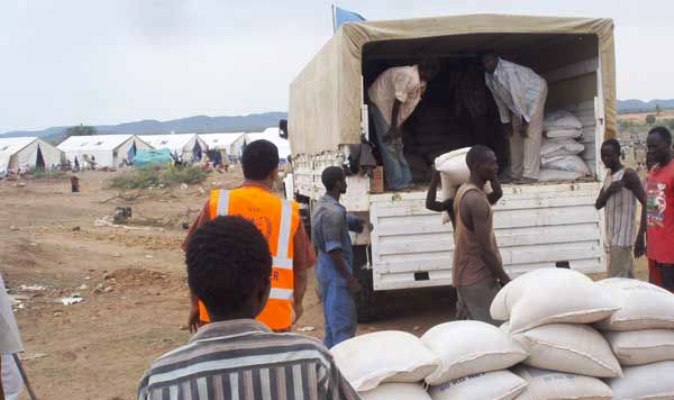 WFP food assistance being offloaded from a truck at a distribution site in the South Kordofan capital Kadugli (File Photo WFP)