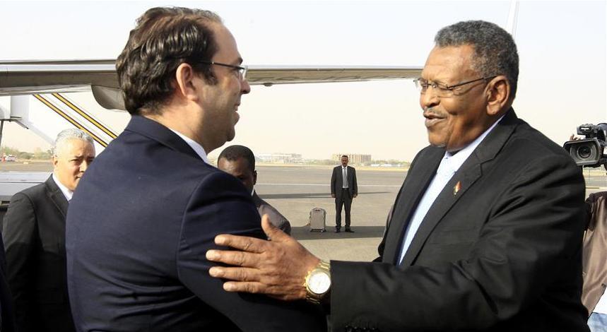 Tunisian PM Youssef Chahed (L) is welcomed by First Vice President and Prime Minister , Bakri Hassan Saleh  at Khartoum Airport on March 22, 2017.  (Ebrahim Hamid/Anadolu Agency Photo)
