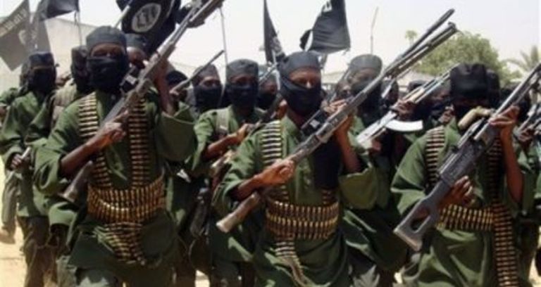 In this photo taken Thursday Feb.17, 2011 Al-Shabab fighters march with their guns during military exercises on the outskirts of Mogadishu,Somalia - (AP Photo)