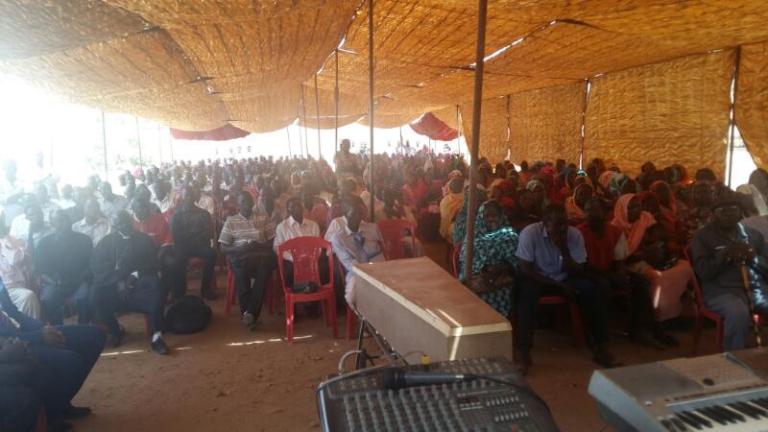 Mourners and priests pray for the late elder of Omdurman Presbyterian Evangelical Church Younan Abdallah on Thursday 6 April 2017 (ST photo)