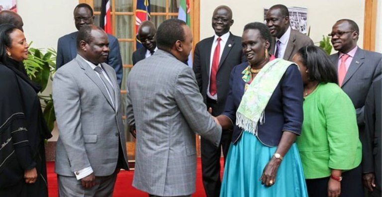 Kenyan President Kenyatta shakes hands with Rebecca Garang and other S. Sudan leaders. on 25 June 2015 (Photo PSCU)