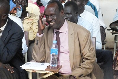Prof. Robert Deng smiles at the church choir as they perform at the university (ST)