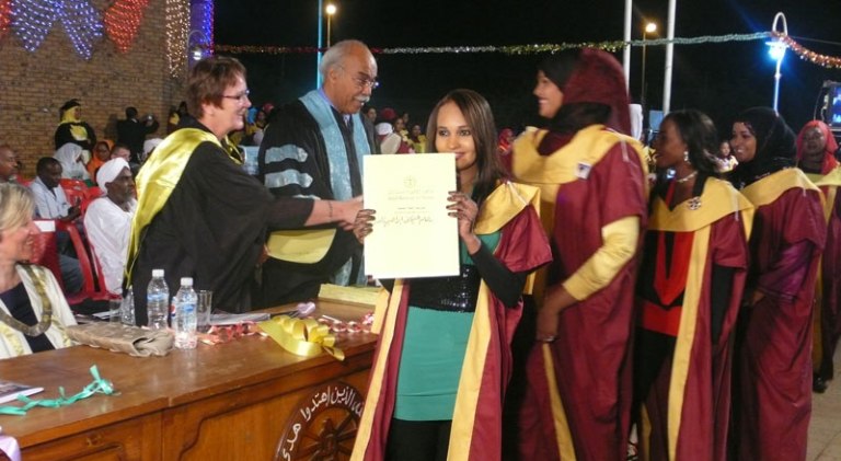 students receive their diplomas from Gasim Bedri president of the Ahfad University for Women and Bergen University College project manager Mildrid Haugland, on 3 June 2015 (Photo Bergeb University)