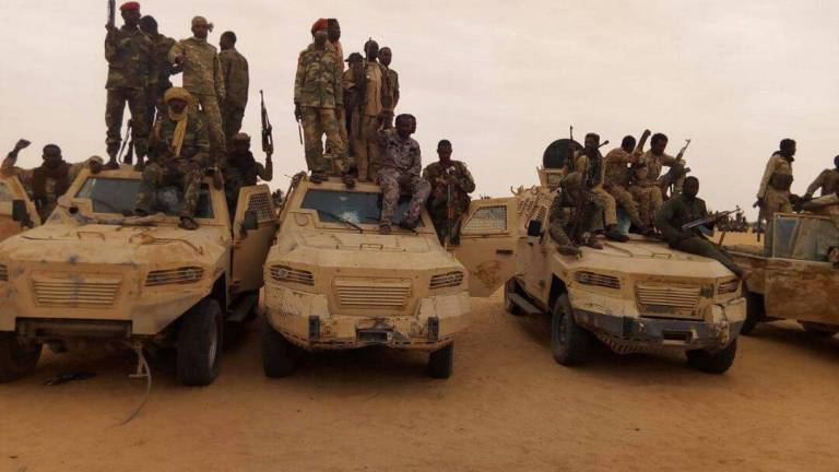 Sudanese soldiers in North Darfur's Wadi Hawar on Egyptian armoured vehicles used by the Darfur rebels in their attack from Libya on 23 May 2017 (ST Photo)