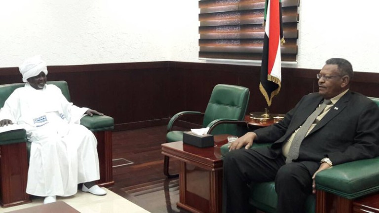 Sudan's FVP and PM Bakri Hassab Saleh (L) receives PCP leader Ali al-Haj in his office on 2 May 2017 - (SUNA Photo)