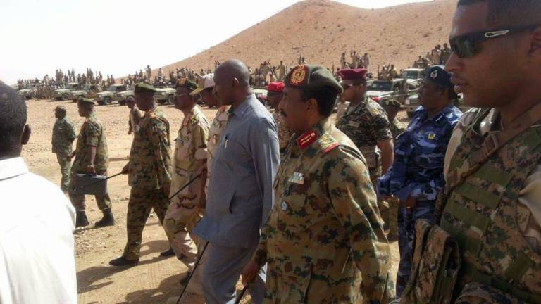 North Darfur governor Abdel wahid Youssef (C) unidentified army general (L) and RSF commander Hametti inspect troops in Ain Siro on 1 June 2017 (ST photo)