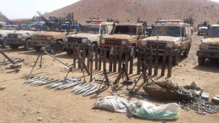 Weapons and vehicles including two ambulances captured from Darfur rebels by the RSF in Ain Siro on 1 June 2017 (ST photo)