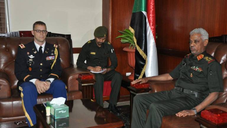 Sudan's Defence Minister Awad Ibn Ouf receives US military attaché Jörn Pung at his office on 4 June 2017 (ST Photo)
