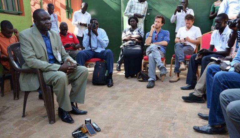 Union of Journalists of South Sudan (UJOSS) chairman Oliver Modi (L) attends a meeting on the killing of South Sudanese journalist Peter Moi in Juba on August 21, 2015 . (AFP/Samir Bol Photo)