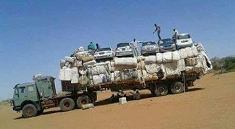 A truck loaded with marchandises and vehicles imported from Libya in North Darfur