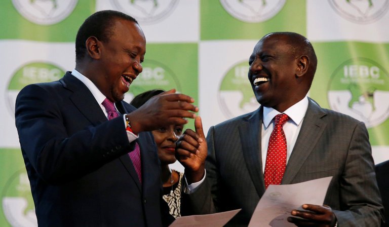 President Uhuru Kenyatta, left, celebrated with Deputy President William Ruto on Friday 11 August 2017 (Reuters/Thomas Mukoya)