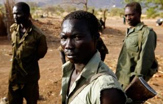 A SPLA-N fighter stands near Gos village in the rebel-held territory of the Nuba Mountains in South Kordofan, May 1, 2012 (Reuters)