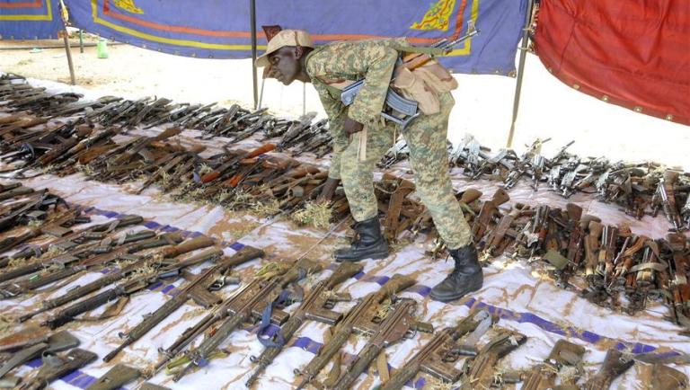 A Sudanese soldier collects weapons voluntarily surrendered by residents in South Darfur State, Sudan, on Sept. 23, 2017 (Xinhua photo)