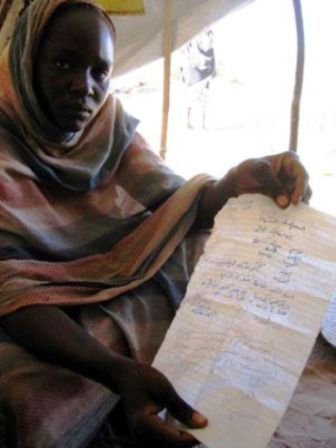 Awatif Abdallah, 19, holds a letter from the police with a medical report scrawled on it saying she was raped and beaten. But the police refused to take her case, and a judge later dismissed it on 22 October 2004. (AFP/ Photo)