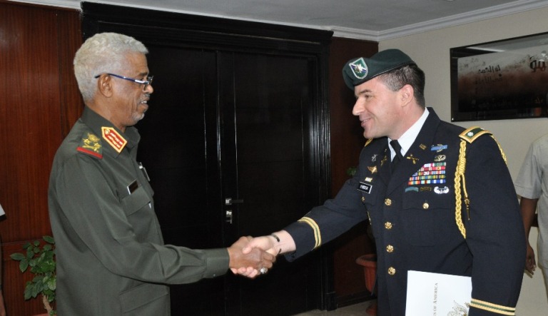 Sudan's Defence Minister shakes hands with Lt Col Adam Matthew Cordish on 7 March 2018 (ST Photo)