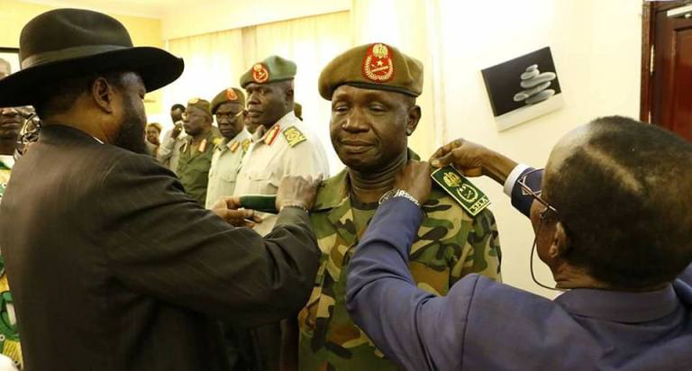 The rank of Lt general is pinned on Lt Gen. James Ajong by President Salva Kir, and Vice President James Wani, during the swearing-in ceremony as SPLA general chief of staff on Wednesday 10 May 2017 (ST Photo)