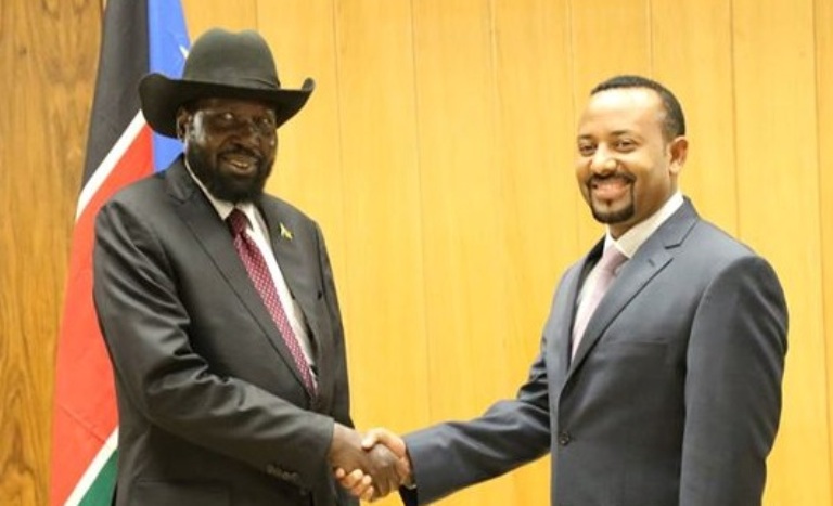 Ethiopian Prime Minister Abiy Ahmed (R) and President Salva Kiir shake hands in Addis Ababa on 30 May 2018  (Photo ENA)