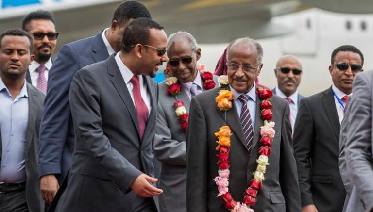 Ethiopia's PM Abiy Ahmed (L) receiveds Eritrea's FM Osman Saleh (R) at  Addis Ababa airport on 26 June 2018 (Photo Mulugeta Ayene/AP)