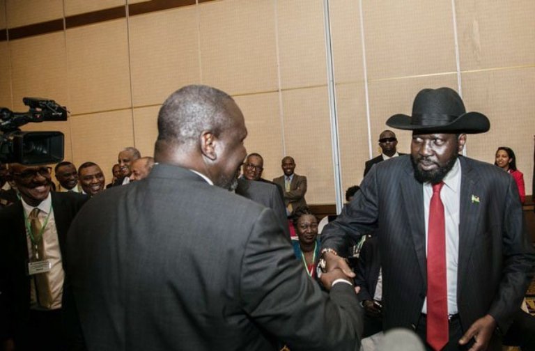 South Sudan's Kiir and SPLM-Io leader Riek Machar shake hands  during the meeting of IGAD head of states and governments on 21 June 2018 (Photo Louis Jadong)