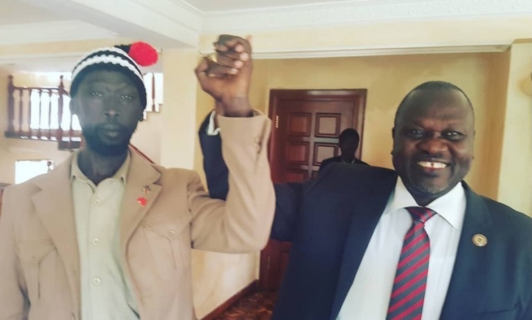 SPLM-IO leader Machar (R) and the head of information office Mabior Garang de Mabior pose for picture on 22 June 2018 (Photo Mabior Granag de Mabior)