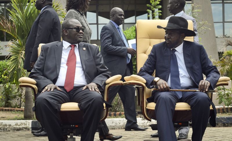 Riek Machar, left, and President Salva Kiir after the first meeting of a new transitional coalition government, in Juba, South Sudan, April 29, 2016. (Photo AP)