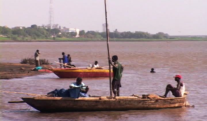 fishermen_in_shallow_fishing_on_the_nile_river_near_khartoum.jpg