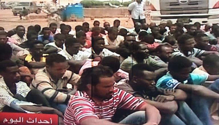 An image from a video footage by Sudan TV shows Sudanese and foreign illegal migrants arrested by the RSF in a remote area of North Darfur heading to Libya on 8 September 2018 (ST photo)