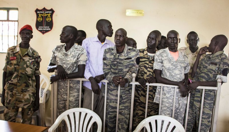 South Sudanese soldiers listen to the verdict being delivered at their trial in a military courtroom in Juba, Thursday, Sept. 6, 2018. (AP Photo)