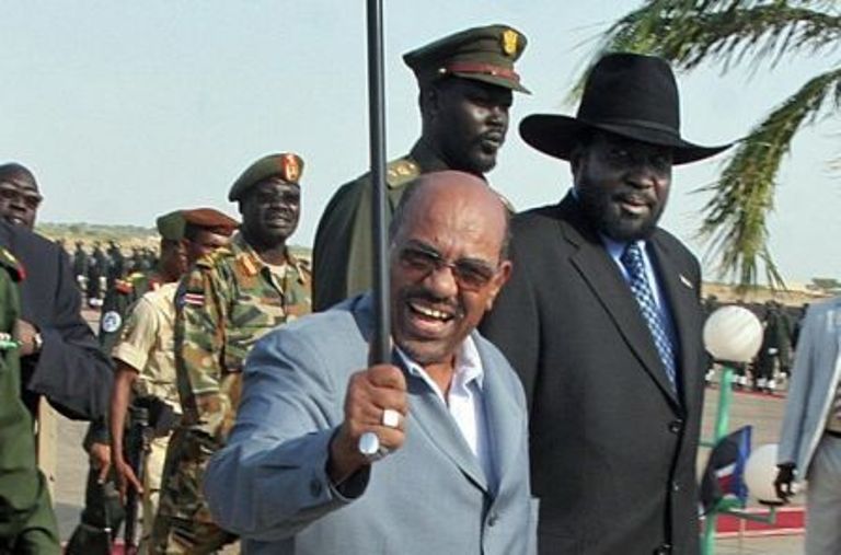a_picture_taken_on_january_9_2009_shows_sudan_s_president_omar_al-bashir_c_and_first_vice_president_salva_kiir_r_arriving_at_upper-nile_state_capital_city_getty.jpg