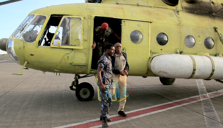 Major General Kinfe Dagnew arrives in Addis Ababa, hands cuffed,  after his arrest near the Sudanese border (Photo ENA)