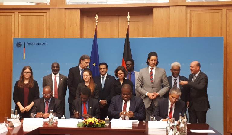 The signing ceremony of the pre-negotiation agreement for peace talks on Darfur in Berlin on Thursday (ST photo)