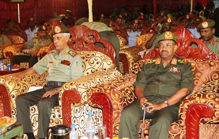 President al-Bashir with Defence Minister Awad Ibn Ouf on 13 September 2015 (File Photo)