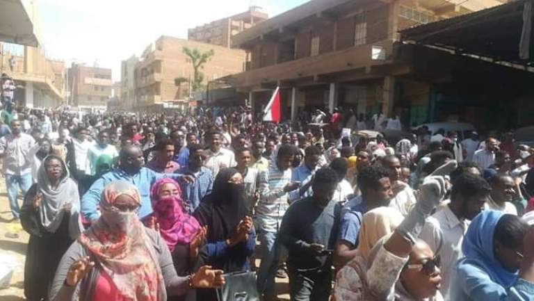 Protesters march in Omdurman market on 24 Feb 2019 (ST Photo)